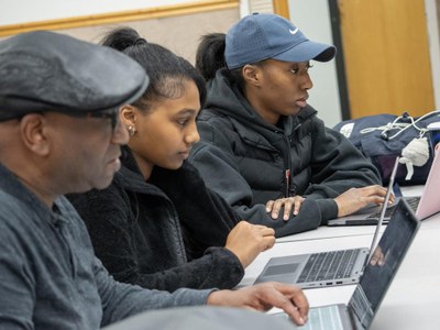 .Greg Jenkins, professor of meteorology and atmospheric science at Penn State, high school student Ariam Gebrezgi, and Penn State Harrisburg student Makaylin Valley go over research during an EnvironMentors meeting.